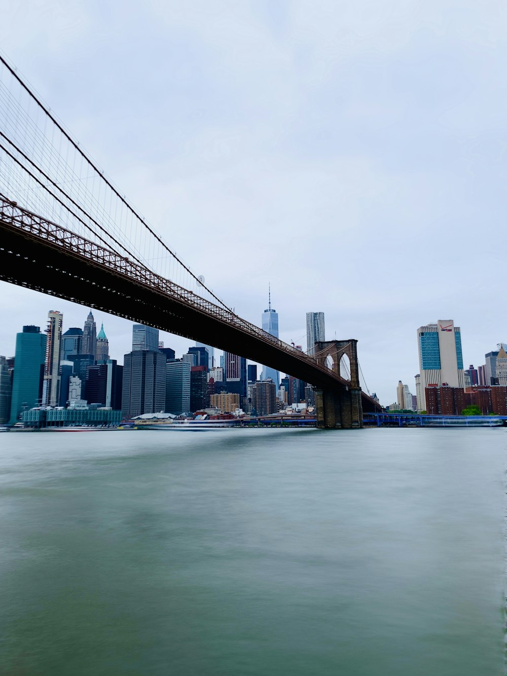 low-angle photo of Brooklyn bridge
