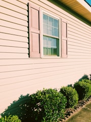 Clean, white, siding after being professionally power washed 