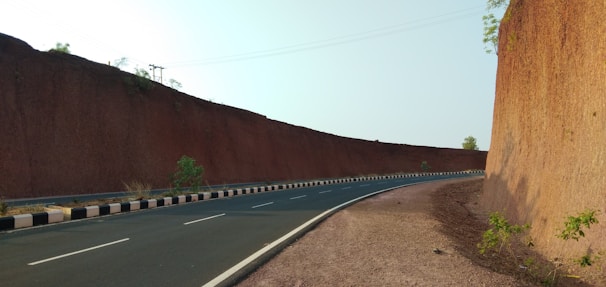 A well-constructed road with clear markings and signage.
