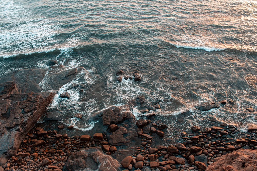 sea water crashing into rocks at beach