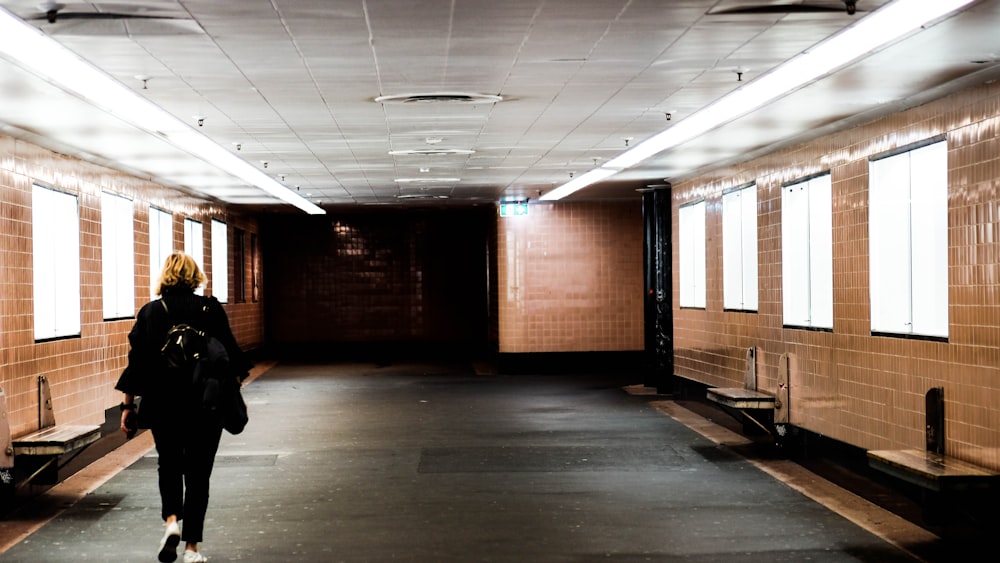 woman walking on empty alley