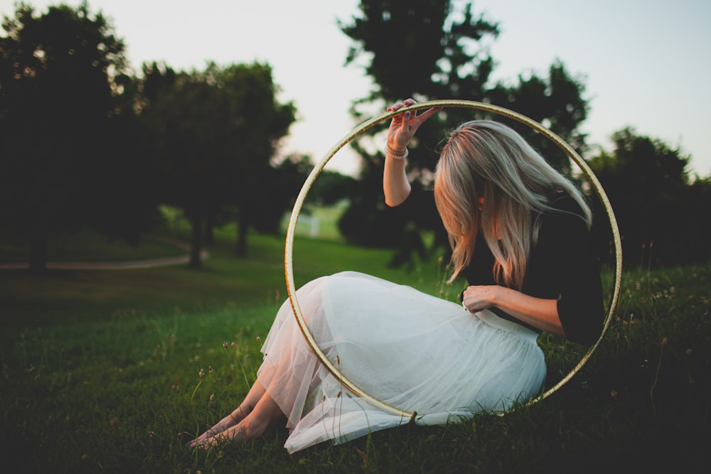 woman holding brown hola hoop