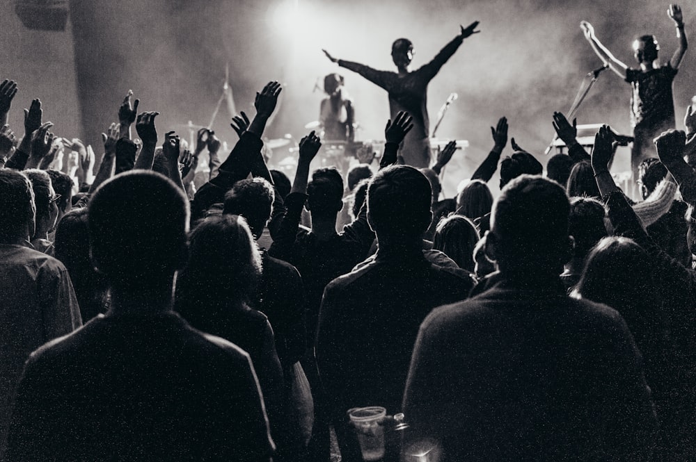 band performing on stage in front of crowd