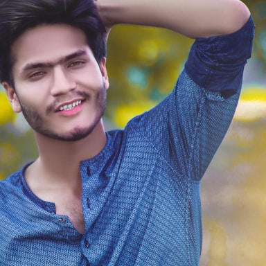 A friendly photo of Brian Cowles smiling warmly in front of a Joplin cityscape.