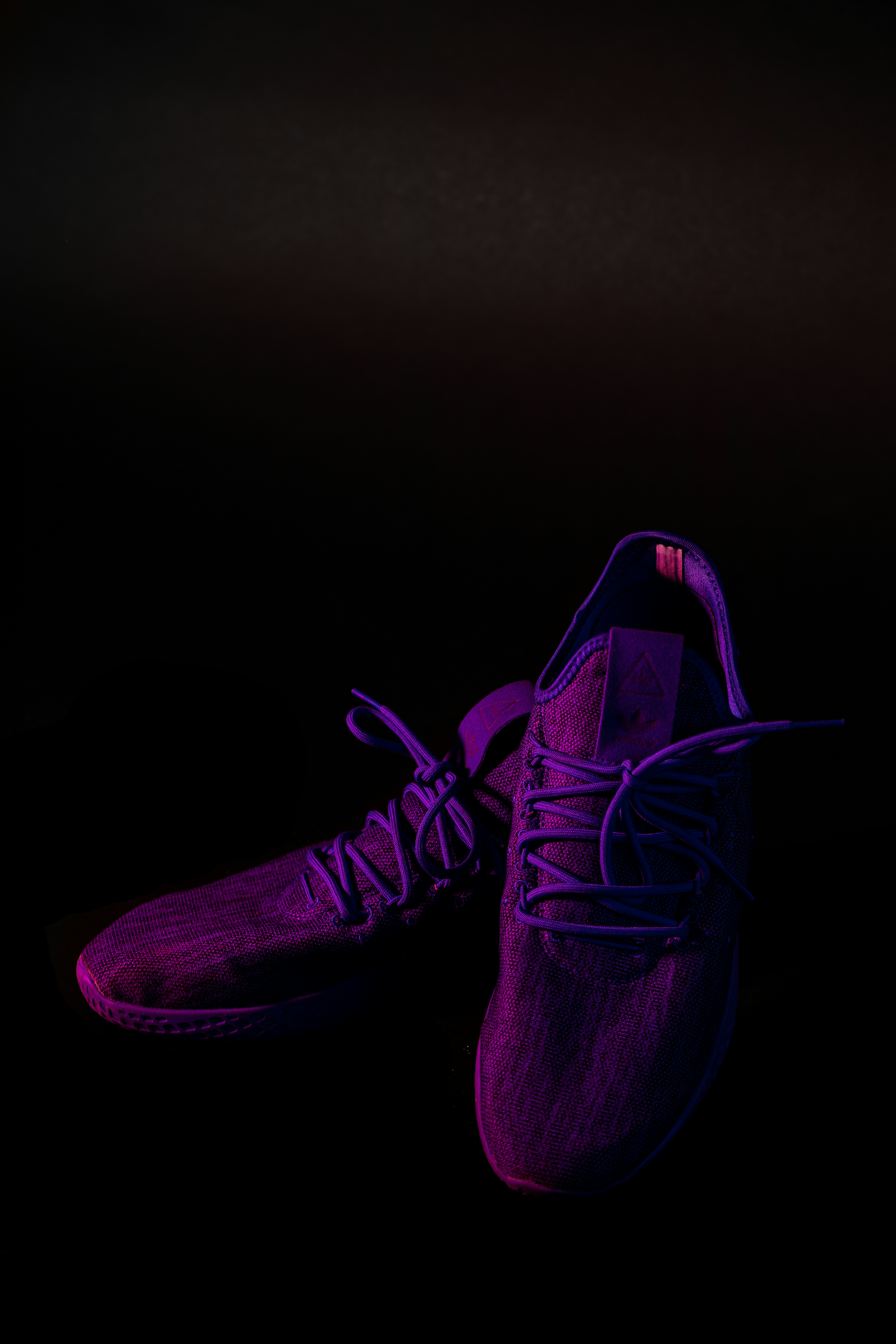 pair of purple mesh running shoes