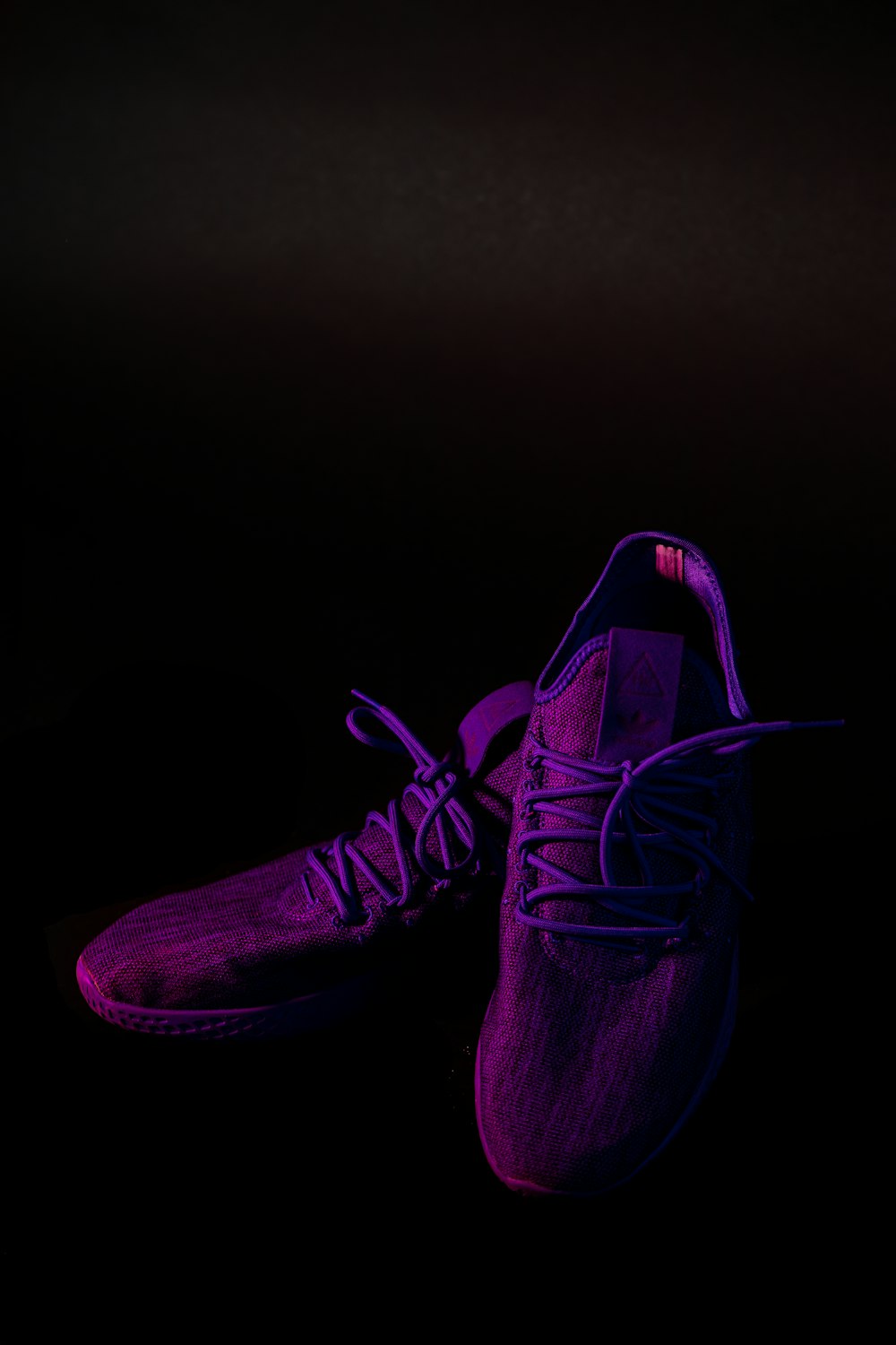 pair of purple mesh running shoes