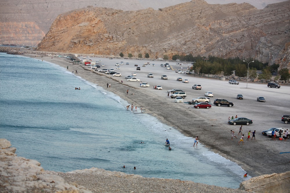 assorted-color vehicle near seashore