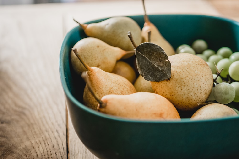 yellow pear on green plastic container