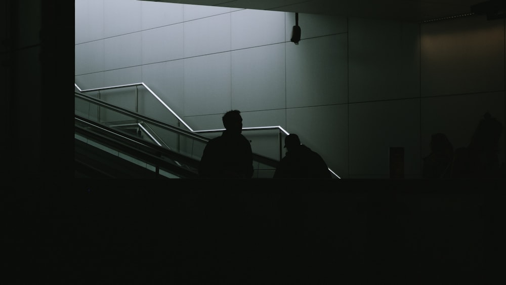 man standing on gray stair