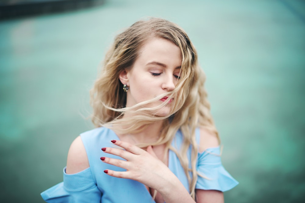 woman in blue off-shoulder shirt