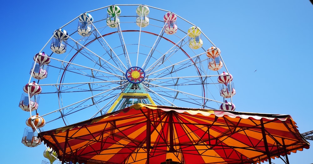 assorted-color Ferris wheel under blue sky