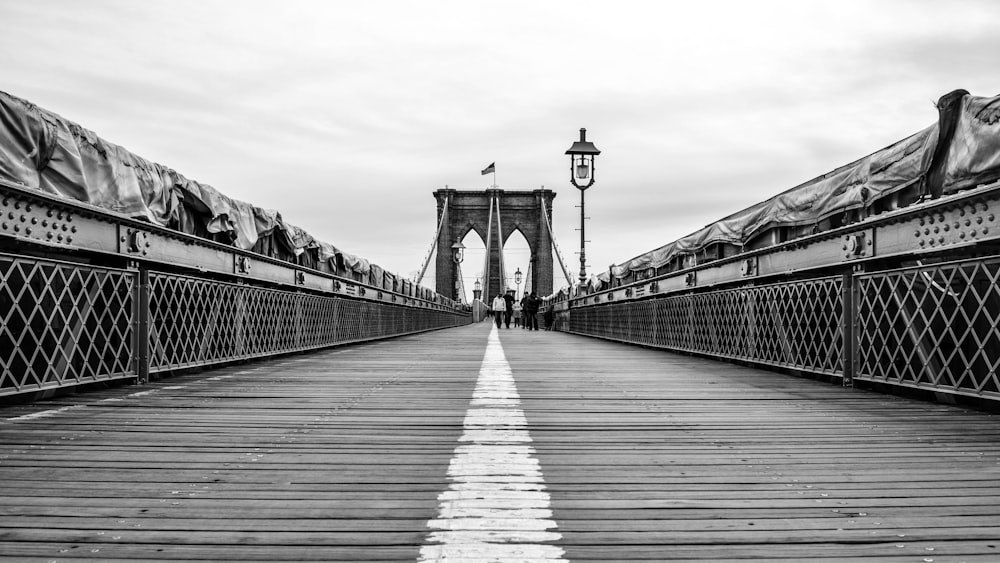 people walking on bridge