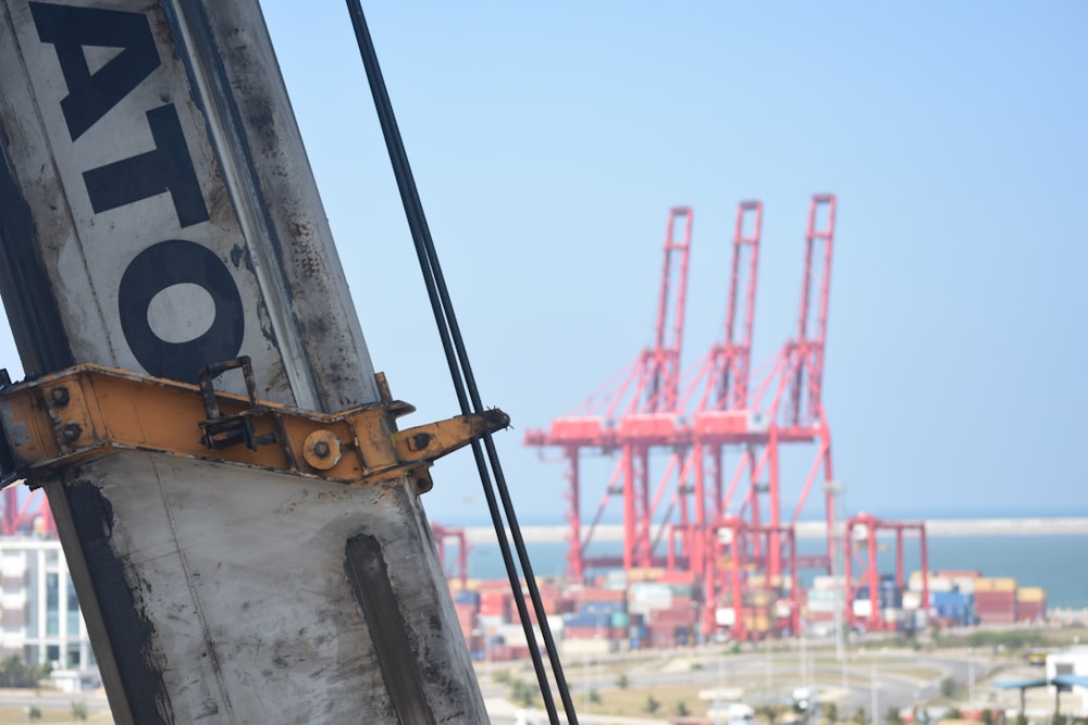 white and yellow metal crane