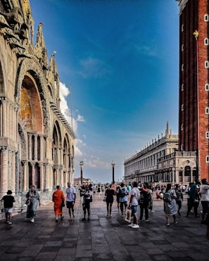 Historic city square filled with vibrant architecture and people.