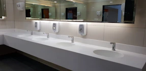 Sanitary facilities in an industrial setting, freshly cleaned and sanitized.