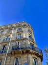 beige concrete high-rise building