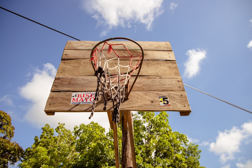 brown wooden basketball hoop with net during daytime