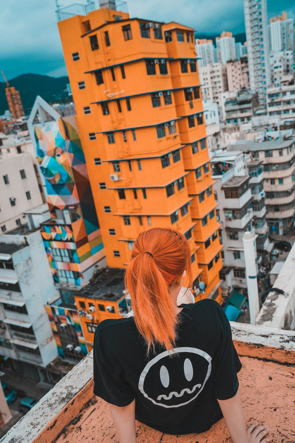 woman standing in corner of building