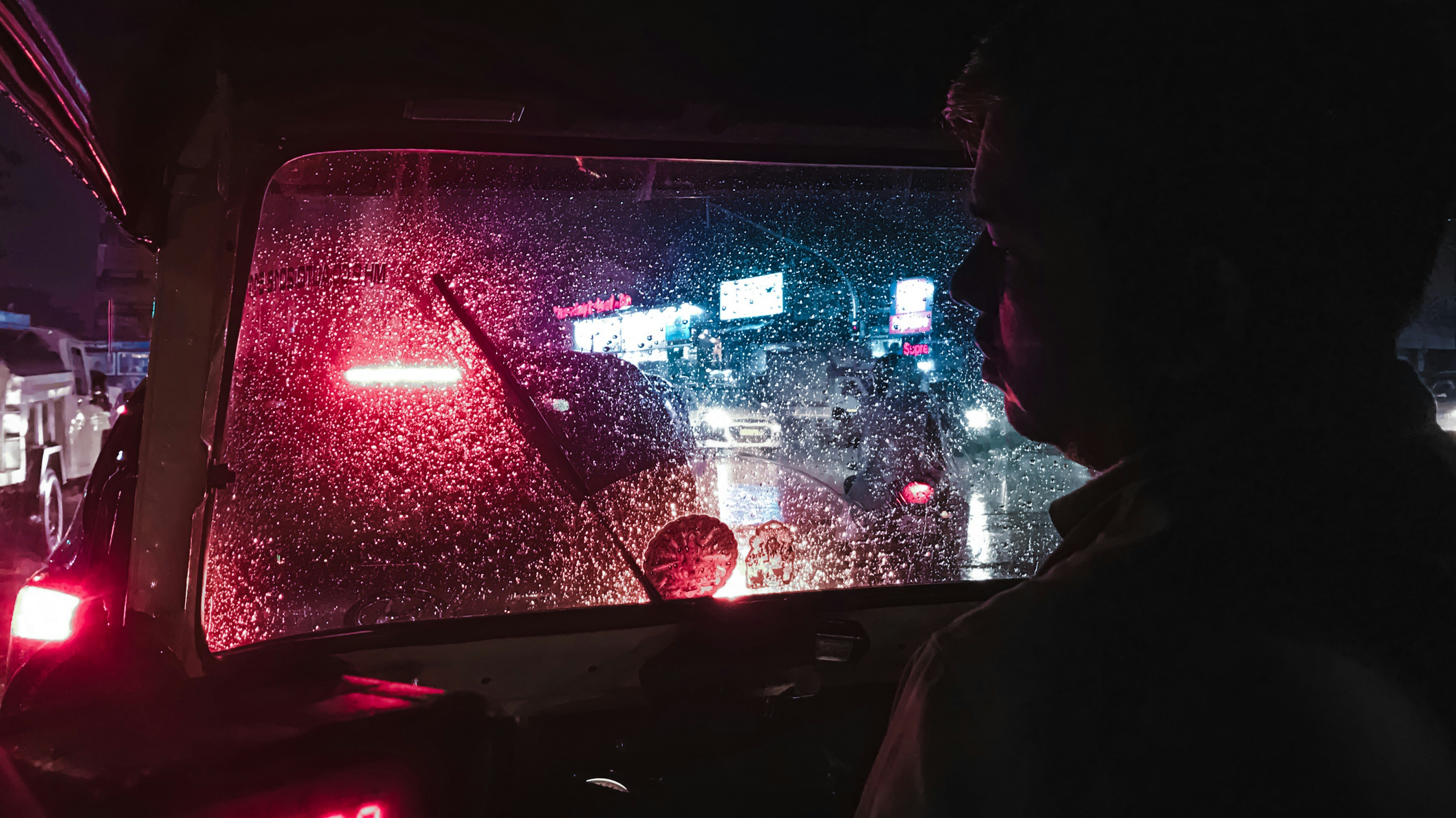 Driver checking phone at stoplight