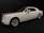 A white luxury car with a sleek design, featuring silver accents and a subtle red stripe. The car is positioned at an angle, showcasing its smooth lines and large wheels against a dark background.