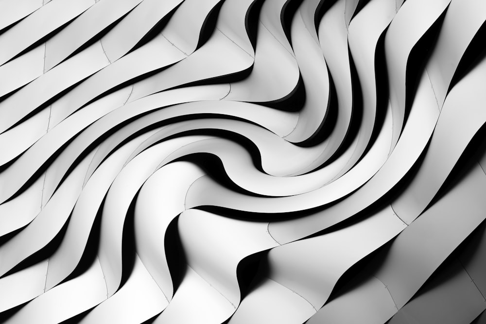 a black and white photo of a wavy pattern