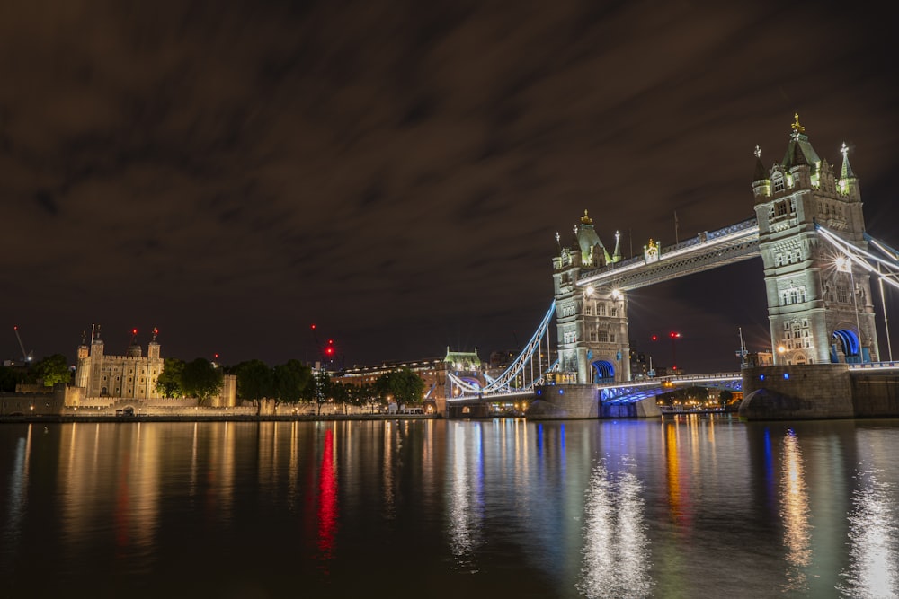 lighted city across bridge