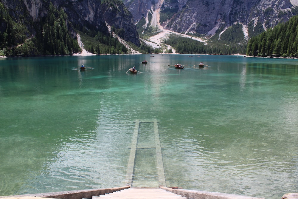 gray stairs leading towards a lake