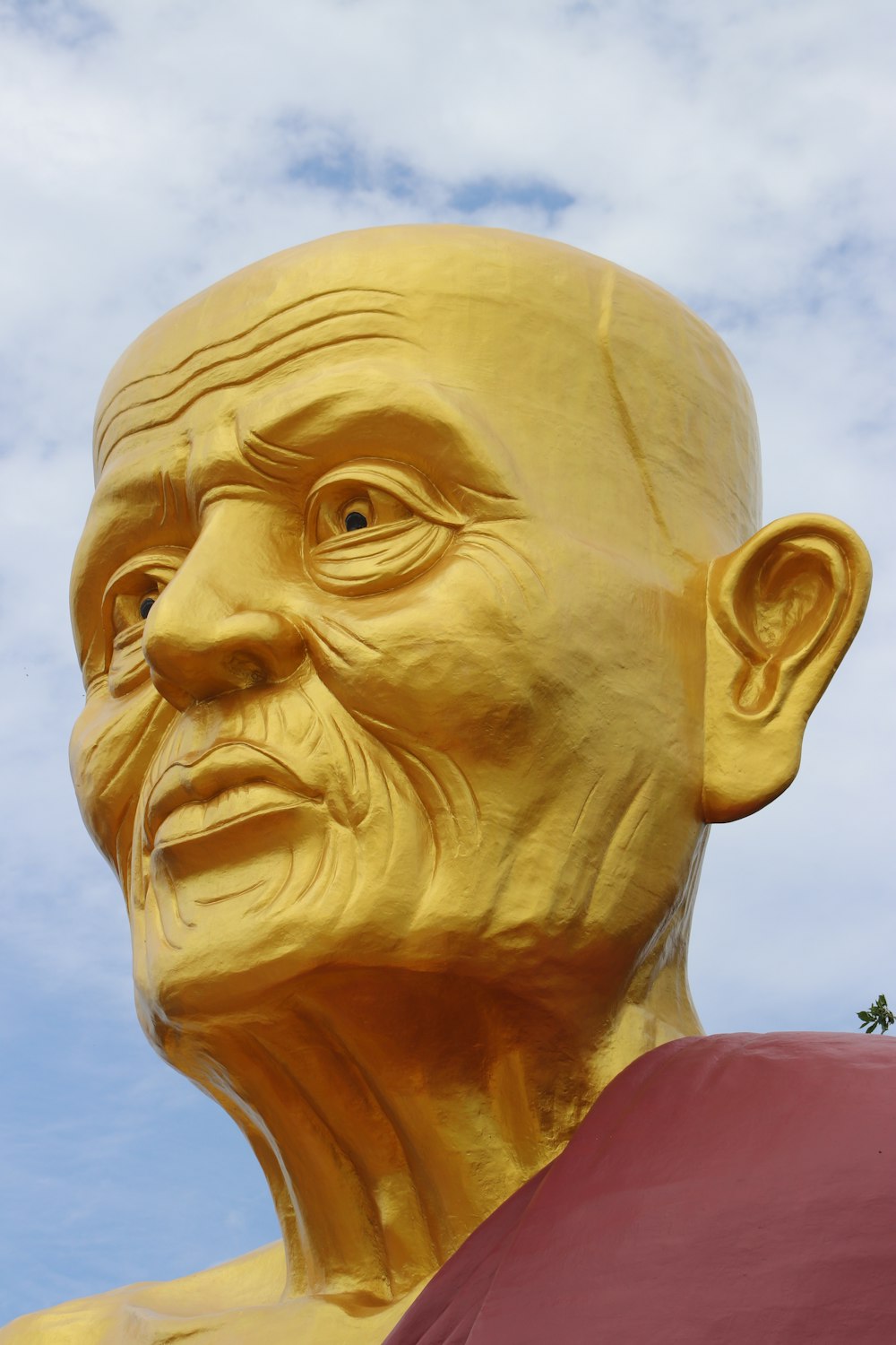 gold statue head bust