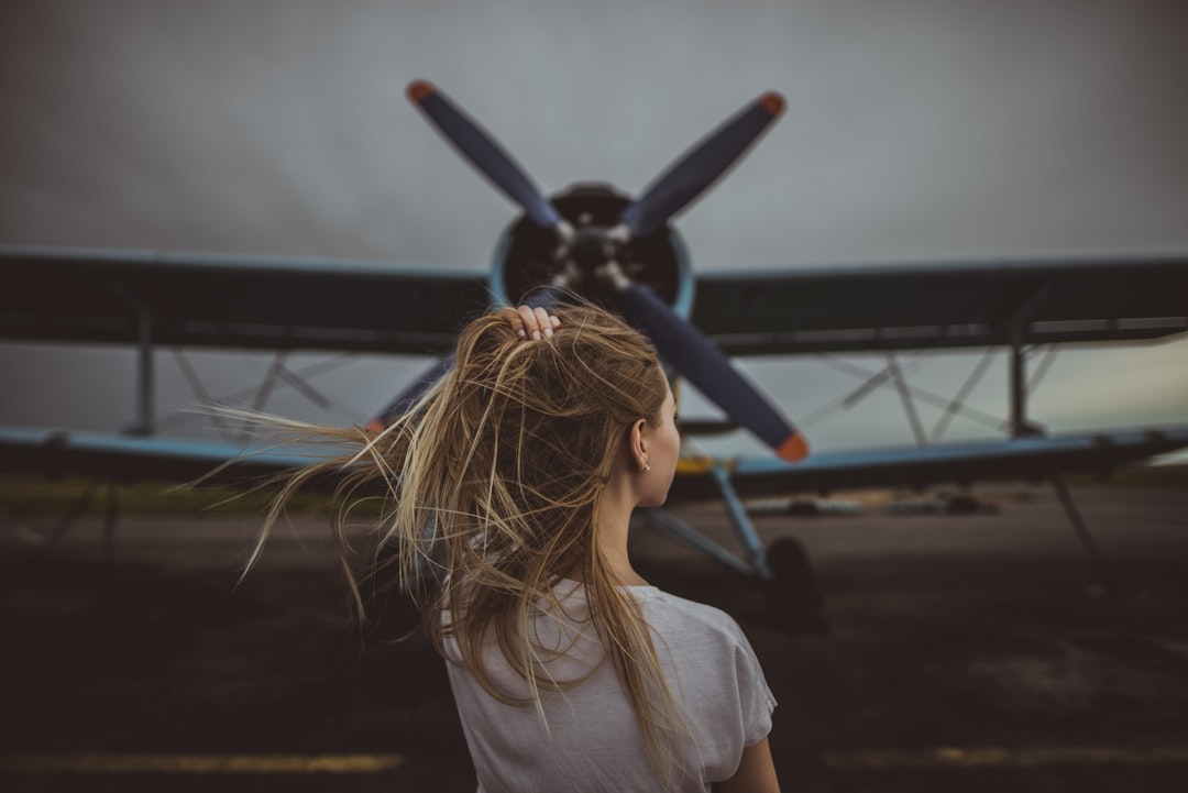 woman in front of plane