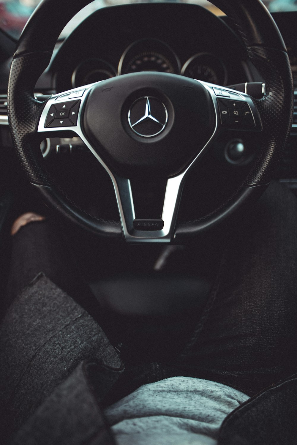 black Mercedes-Benz steering wheel