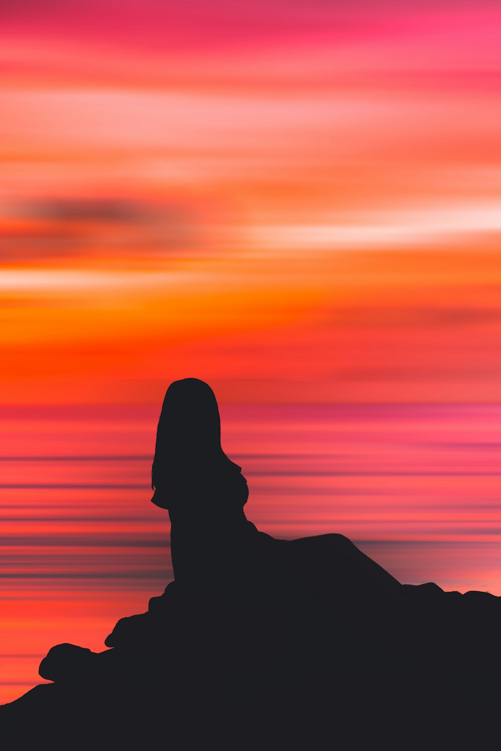 silhouette de personne au coucher du soleil