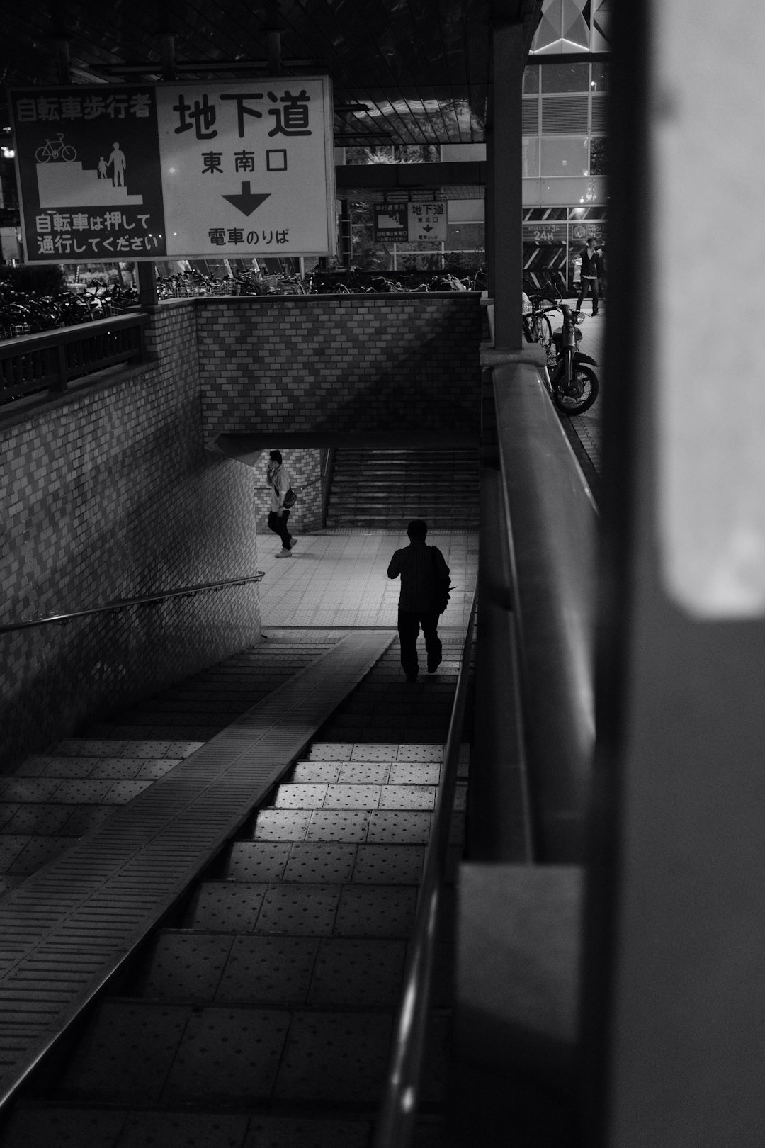 man walks down the subway station