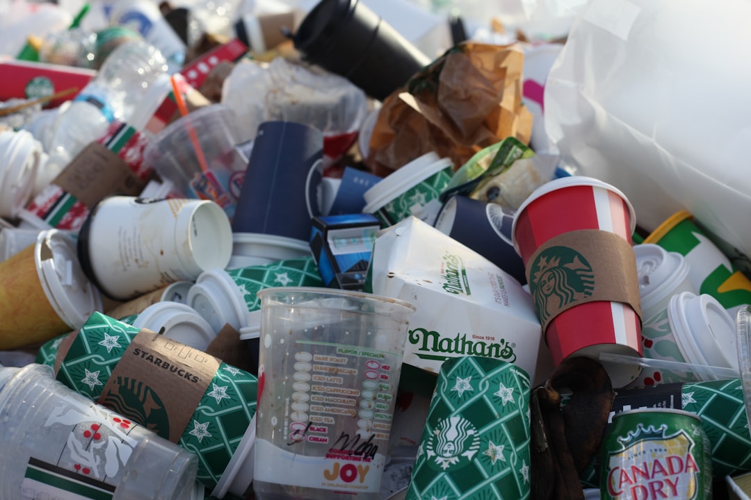assorted-color disposable cup lot, This photo was taken in New York in December 2018 during my Christmas stay in the city. I was wandering the streets and was amazed by a pile of coffee-to-go cups and decided to take a picture.<p></figure>I would call this photo "Trash-To-Go" because the cups are used only a few minutes till they are trash.</p><p>This photo is my most downloaded photo. I see this photo is constantly used to raise awareness of single-use plastic. Keep up the good work!