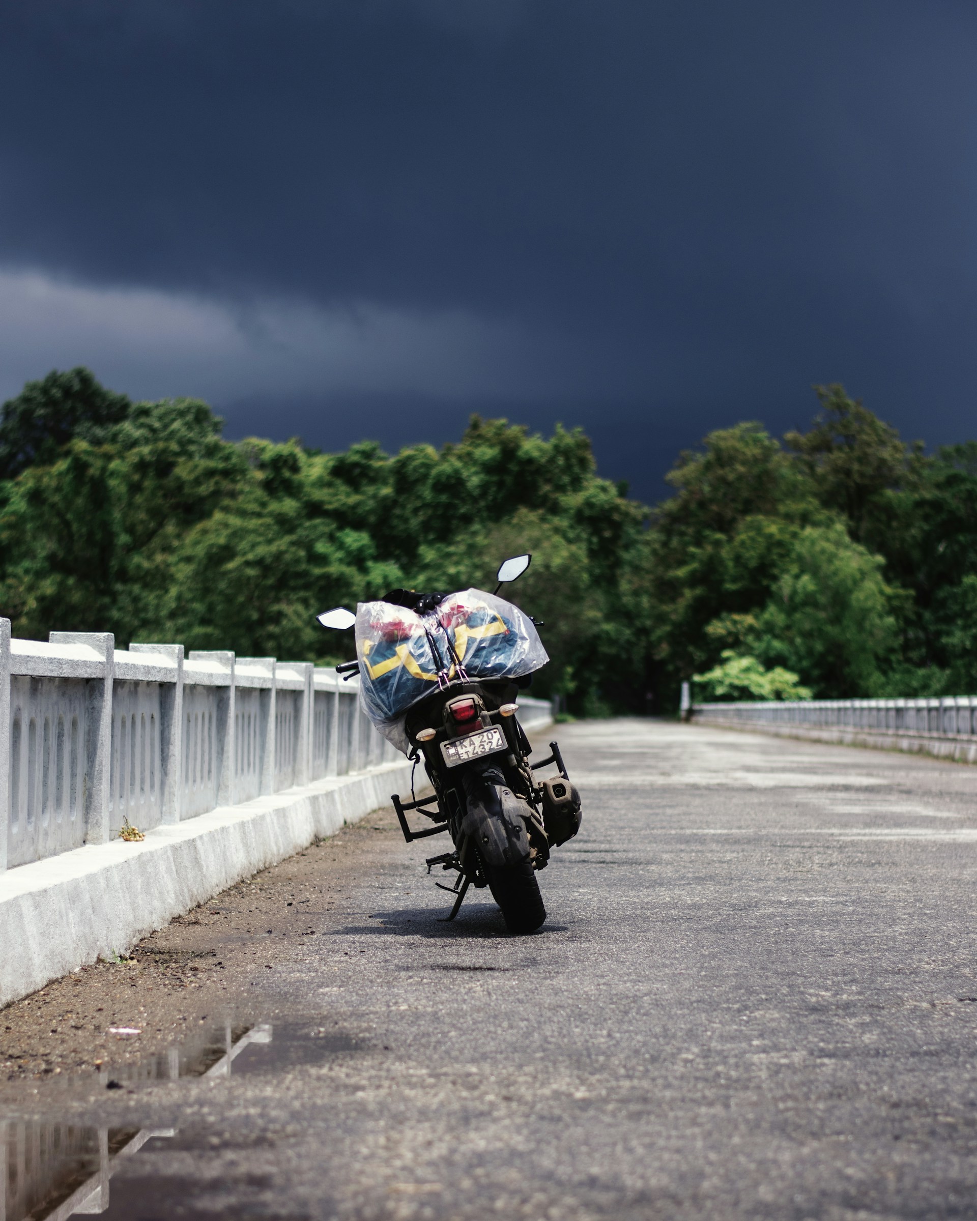 woman wearing yellow long-sleeved dress under white clouds and blue sky during daytime