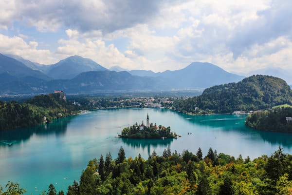 Magnificient view of the Bled Lake. To catch this view, I had to take a pretty steep walk in the forest. On top, it's just perfect ! Slovenia is simply a green pearl in the earth of Europe. You have to visite it !by Arnaud STECKLE