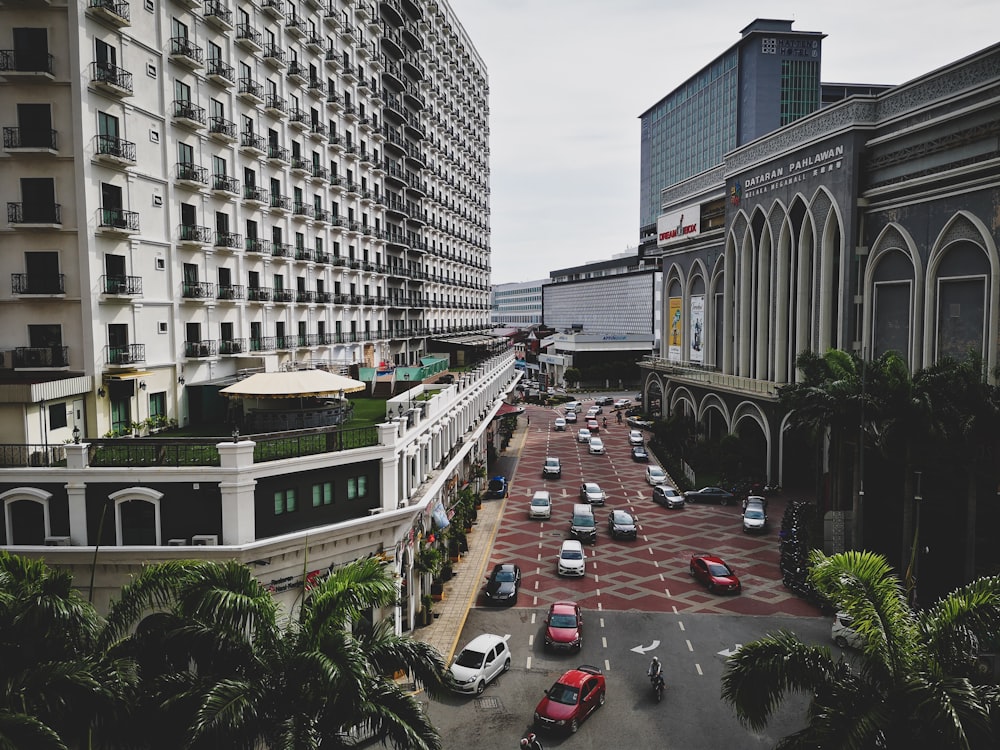 vehicles beside buildings