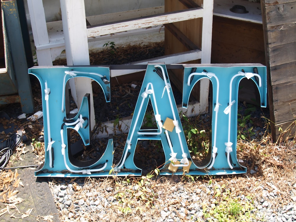 blue and white eat signage