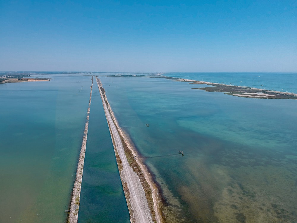 road between body of water