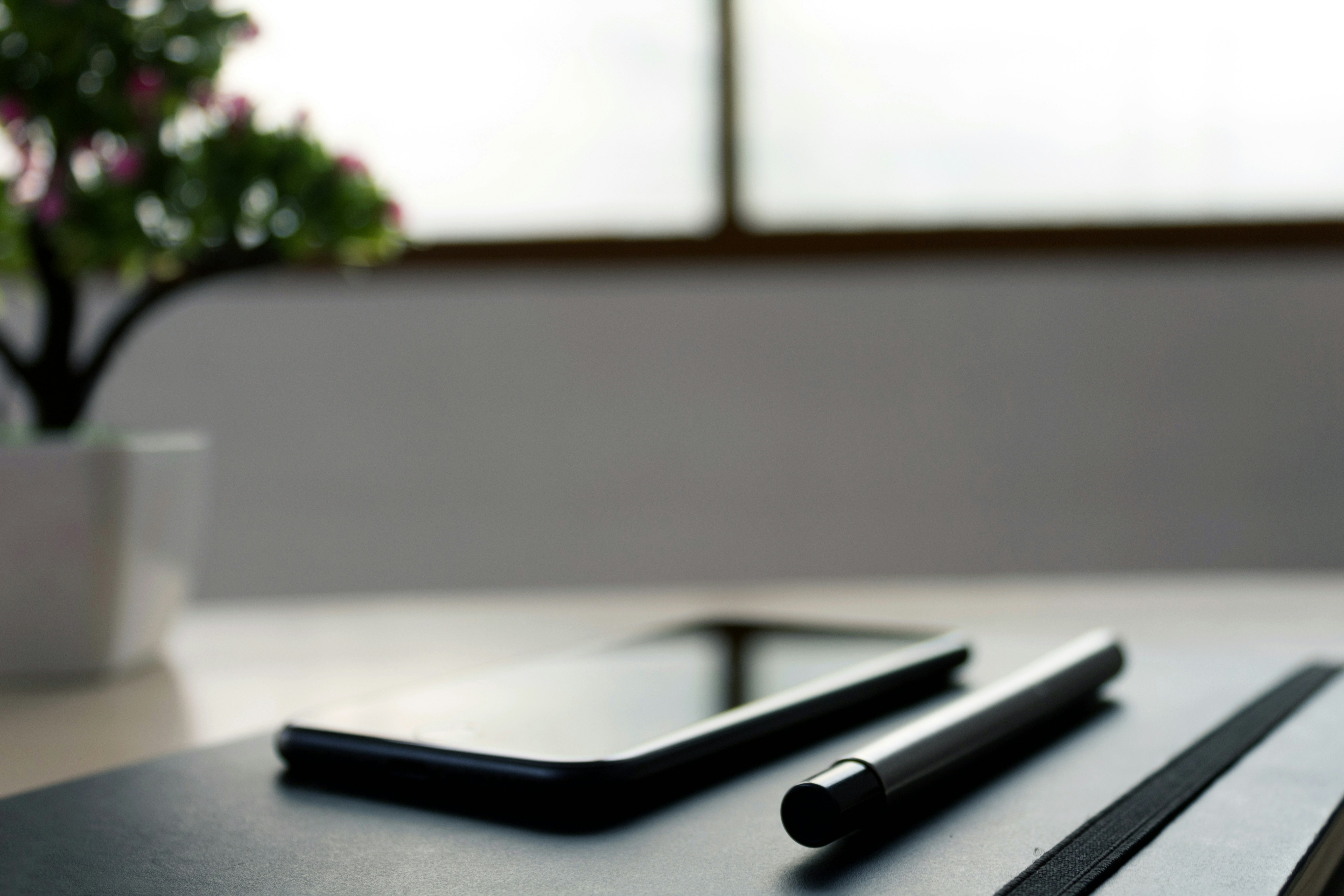 mobile phone on wooden table, Stock photo of the pen, mobile and notebook by rupixen