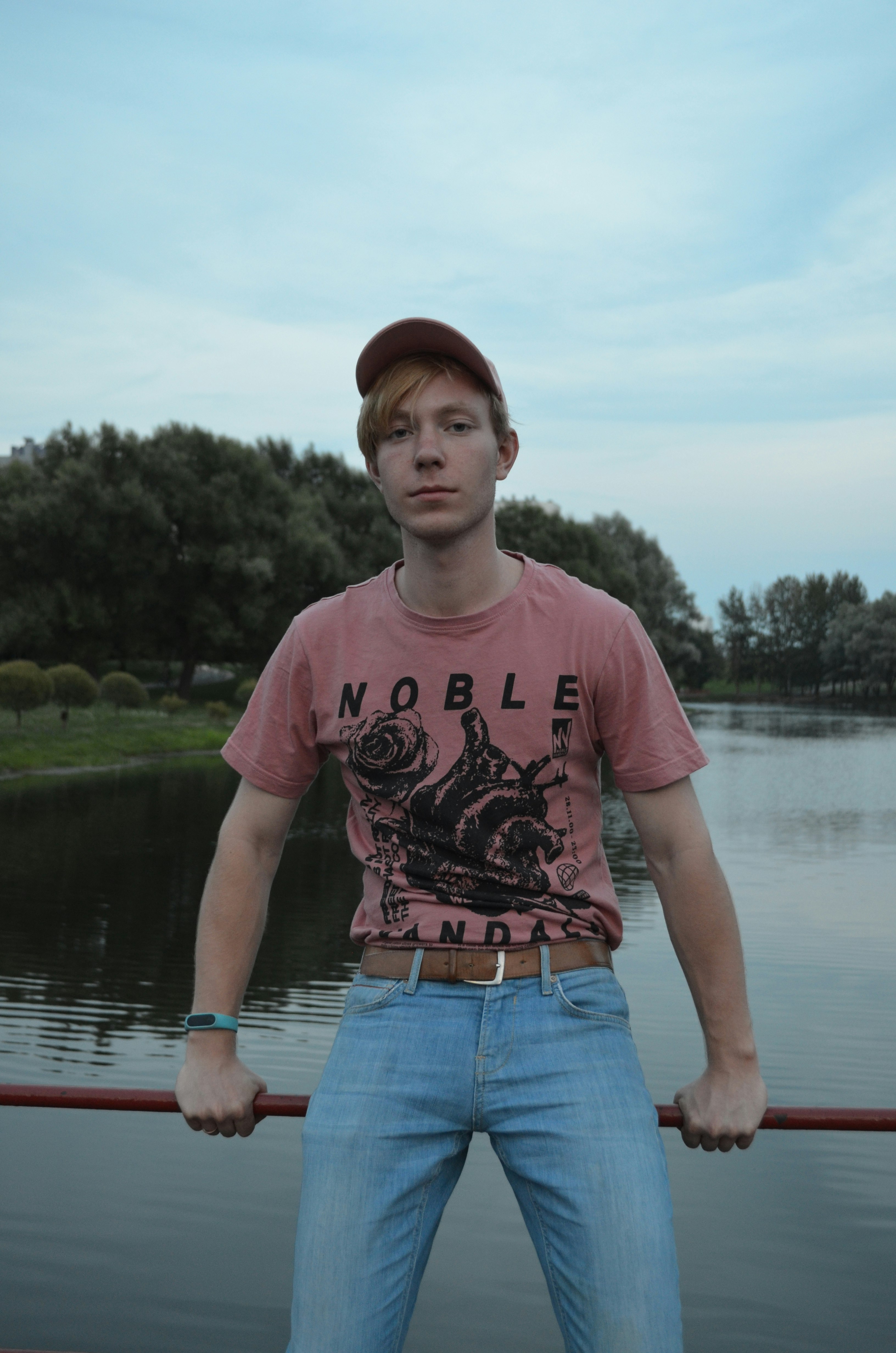 man in peach and black noble crew-neck t-shirt