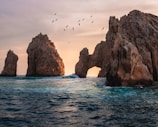 rock formation on the ocean photography