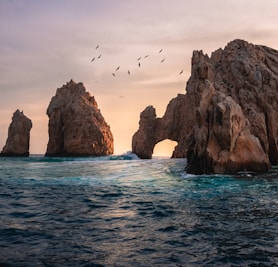 rock formation on the ocean photography