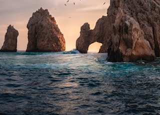 rock formation on the ocean photography
