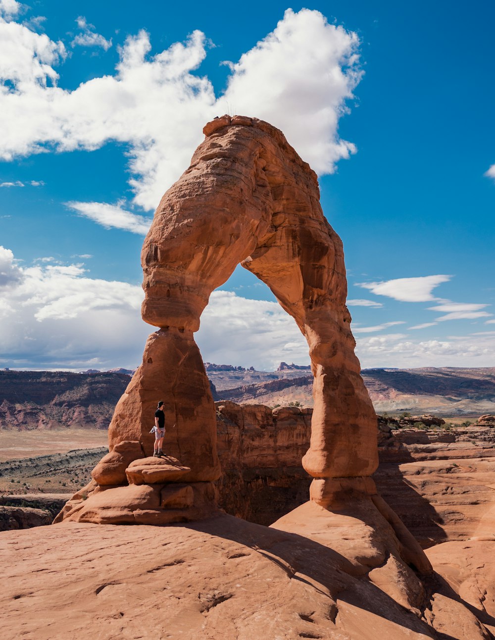 man standing on rock formation