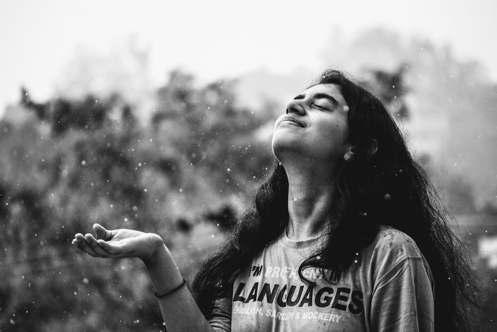 closed eyed woman tilting her head backwards