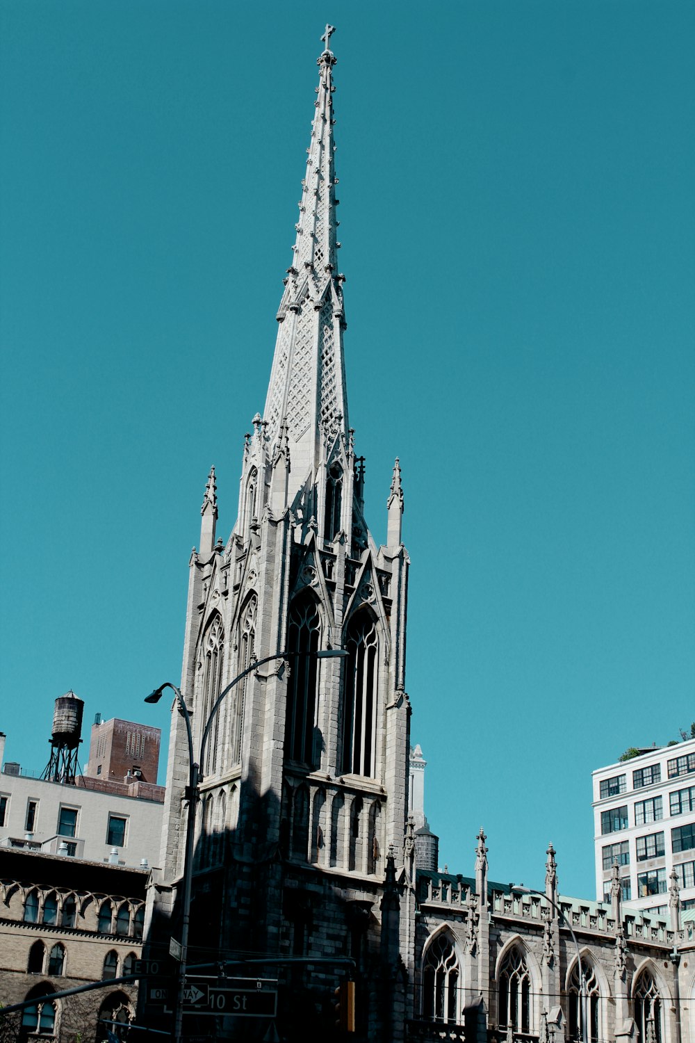 selective focus photography of gray concrete building under blue sky