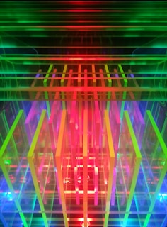 a multicolored image of a building with a clock on it