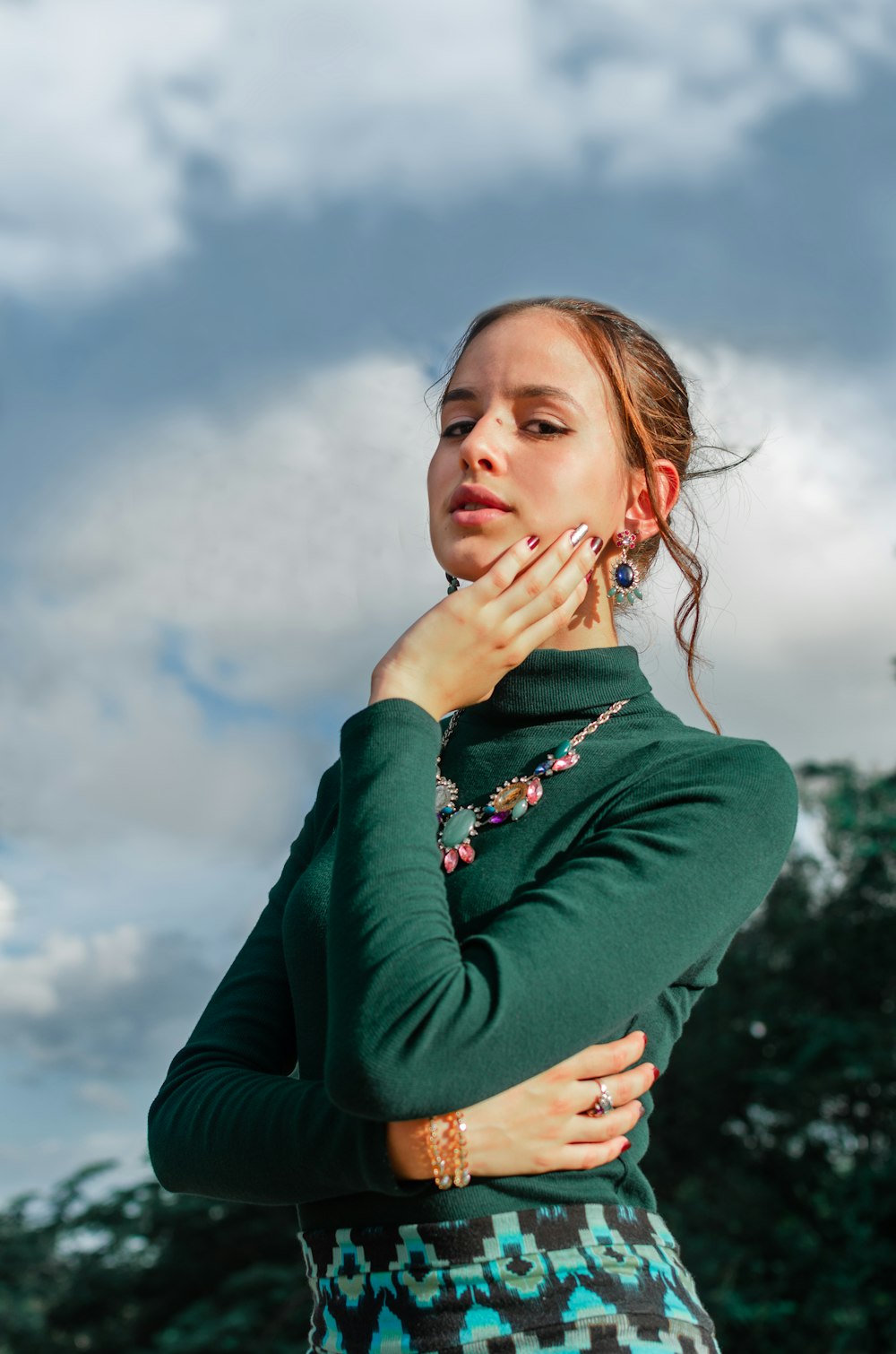 woman in green turtleneck long-sleeved top