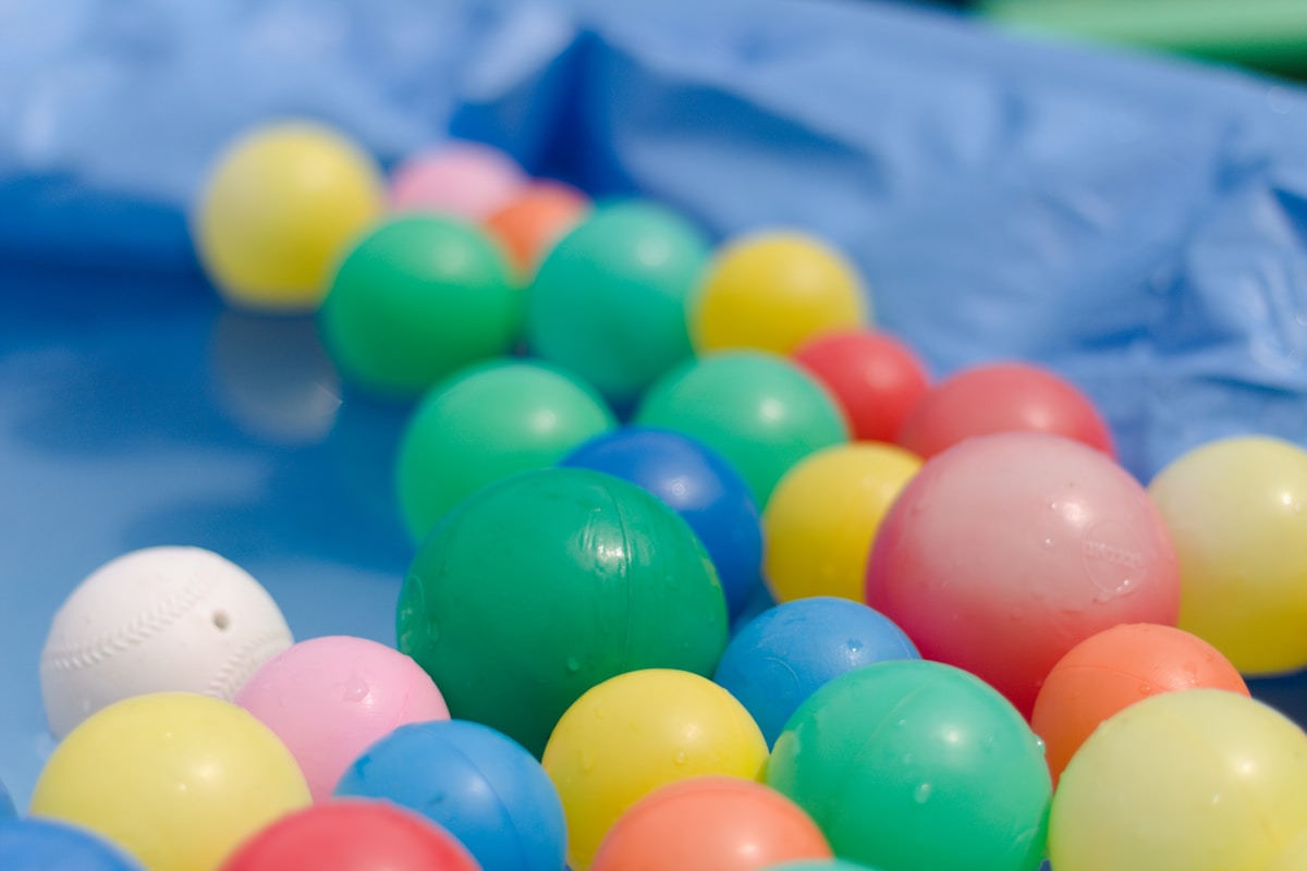 pile-of-assorted-color-ball-lot-pYYK1rjSekU collection background image