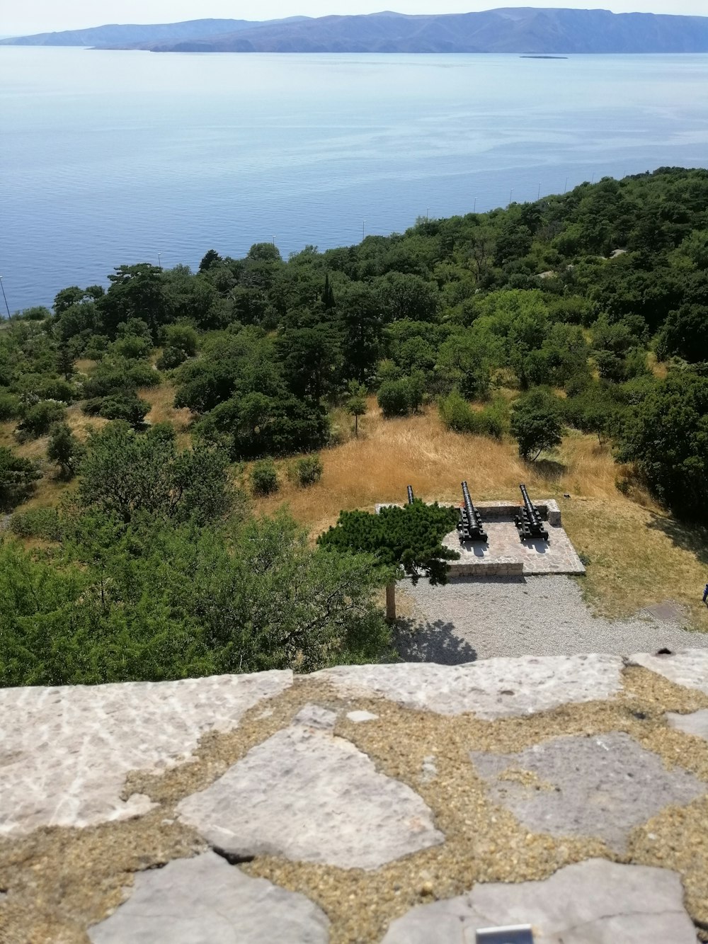 a view of the ocean from the top of a building